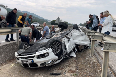 Takla atan araçtan yaralı kurtuldu